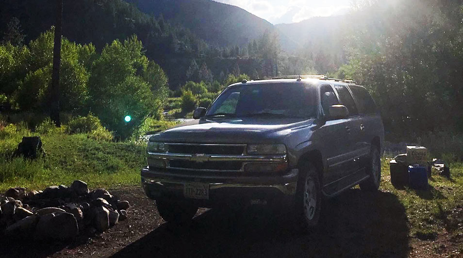 a Suburban truck in the sun
