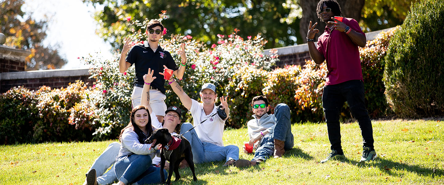 Friends hanging out at a football game at Hampden-Sydney College